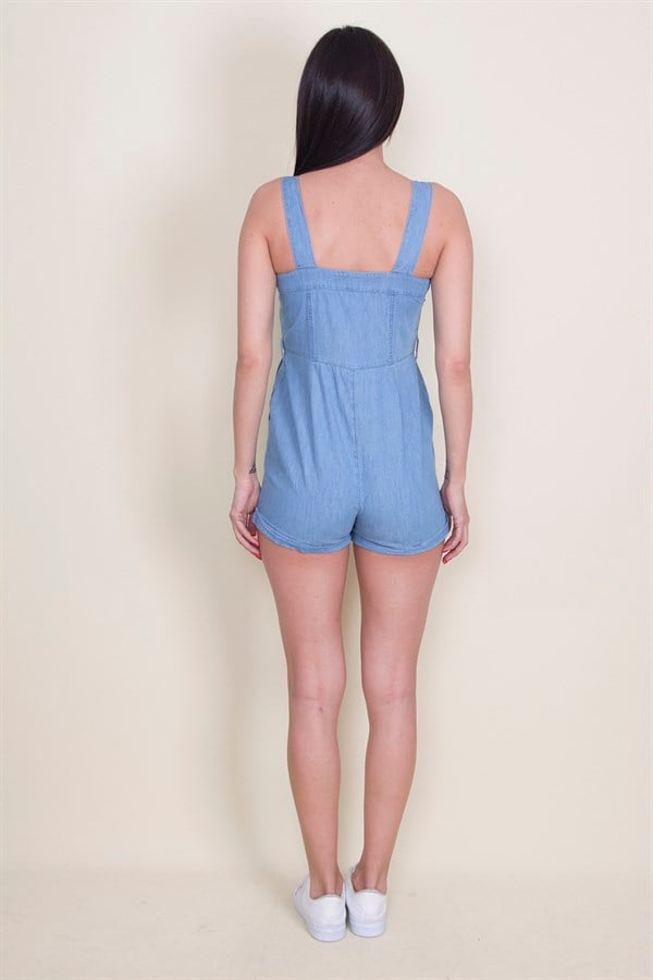 Combinaison à bretelles en denim bleu pour femme, avec boutons et poches
